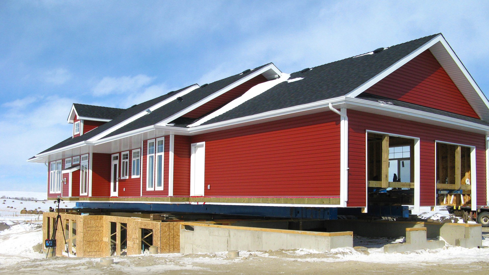 pre built ready to move home being placed onto a basement by nelson homes red house.jpg